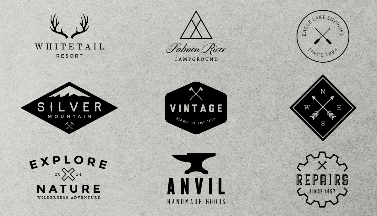 Nine black vintage lockups on gray paper: antlers, mountains, crossed oars, pickaxes, arrows, logs, an anvil, and a gear